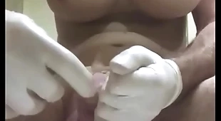 Gigantic butt plug just about condom wrapround into urethra