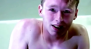 A frank blond boy is near tears while being spanked