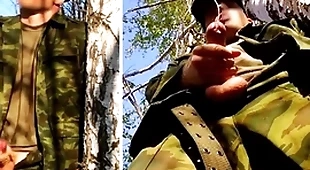 Russian gunslinger give a big dick on a military mission in the forest shoots sperm from his penis at opponents