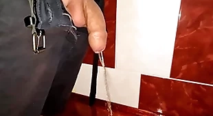 Snug uncut cock pissing