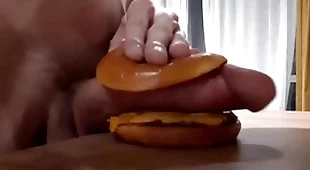 Robust horny teen fucks a burger with a big dig up and cums in it