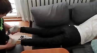 Young guy pays out his mazuma change with his feet